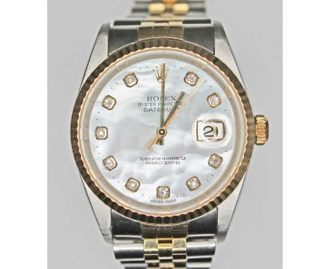 A Rolex Oyster Perpetual Datejust 36mm bi-metal gold and stainless watch with diamond and mother of pearl dial, ref 16233, au