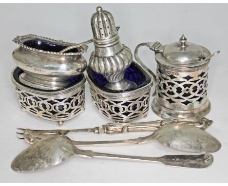A mixed lot of hallmarked silver to include a four piece cruet set with blue glass liner, pepperette, two teaspoons and a pic