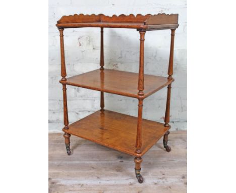 A Victorian oak three tier whatnot, height 74cm.Condition: One of the feet with castor has previous repair with putty/filler 