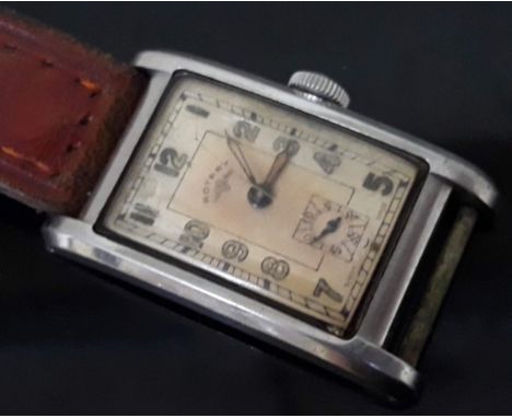 An Art Deco Rotary tank type stainless steel wristwatch, 22mm x 40mm.  Condition - half of strap missing, glass cracked and s