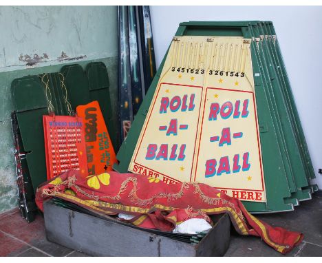 A vintage penny arcade or fairground game 'Roll-A-Ball' with eight hand painted segments with stands, ball ramps, score board