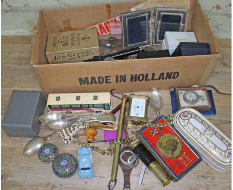 A mixed lot to include various coins, a hallmarked silver photo frame, a trench type watch strap, a miniature carriage clock,