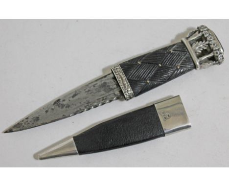 A Scottish Sgian-Dubh knife, white metal foliate pommel set with a citrine coloured stone, carved wooden grip, silver mounted