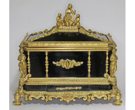 A French 19th century gilt metal and ebonised casket having figural finial and columns, scroll work throughout, mask handles,