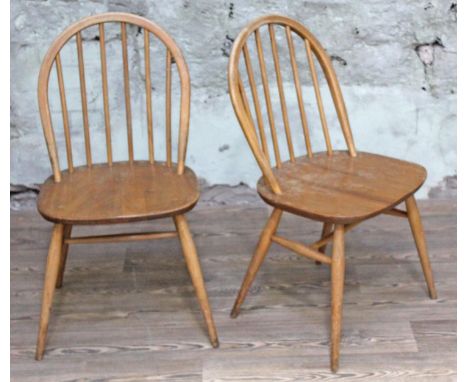 A pair of Ercol blonde elm and beech chairs.  