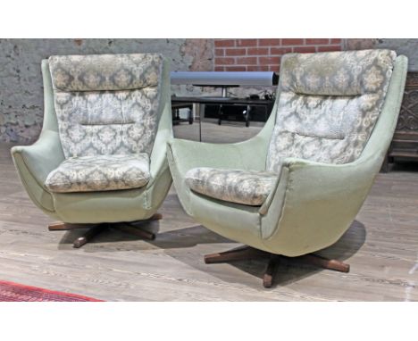 A pair of Parker Knoll swivel lounge chairs. &nbsp;(This item may not comply with the Furniture and Furnishings (Fire) Regula