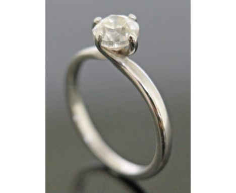A diamond solitaire ring, the stone approx. 0.83 carats, white metal band indistinctly marked, gross weight 2g, size J/K.  