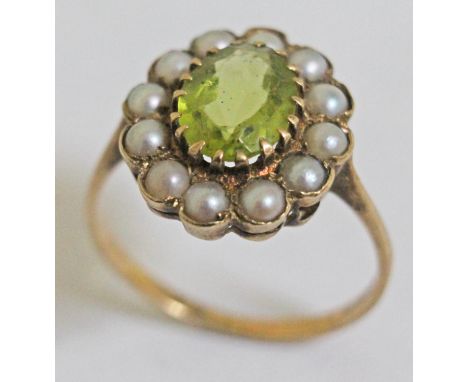 A hallmarked 9ct gold seed pearl and peridot ring, flower head cluster approx. 14mm x 16mm, gross weight 2.9g, size P.  