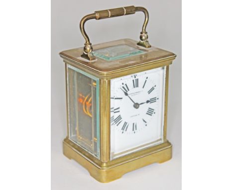 An early 20th century brass carriage clock, the enamel dial having Roman Numerals and inscribed Mappin &amp; Webb Ltd, height