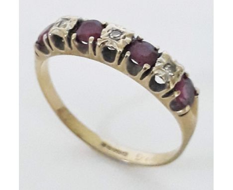 A hallmarked 9ct gold ring set with diamonds and ruby coloured stones, gross weight 2.2g, size R.  