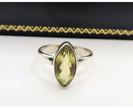 Vintage Sterling Silver Peridot Ring. A fine quality sterling silver ring set with a 14x6mm (2ct) Marquise Cut Peridot. Ring 