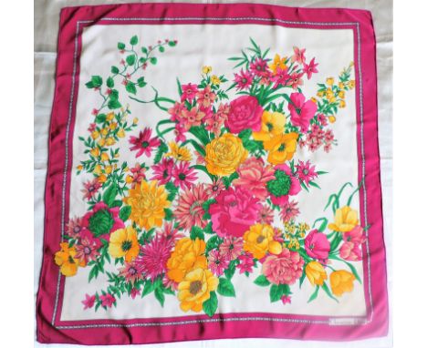 Vintage Christian Dior Silk Scarf Floral Pattern with Dior Logo Border. A beautiful and vibrant silk scarf by Christian Dior.