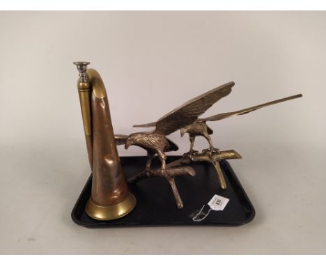 A pair of brass birds in flight, wing span 17 1/4" plus a copper and brass bugle marked John Grey &amp; Sons London