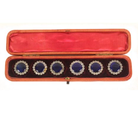 Buttons - a cased set of six silver mounted 19th Century buttons each with domed blue enamel centre within a paste set border