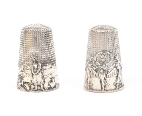 Two French silver fable thimbles, 'The broken pitcher' stamped 'France', and another 'la Ronde' girls dancing with garlands t