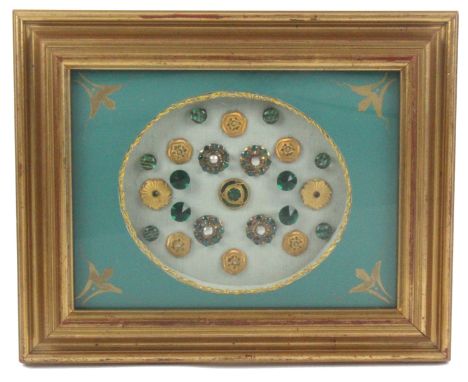 Buttons - a framed display of 23 buttons mostly 19th Century and comprising a set of six gilt metal and enamel floral buttons