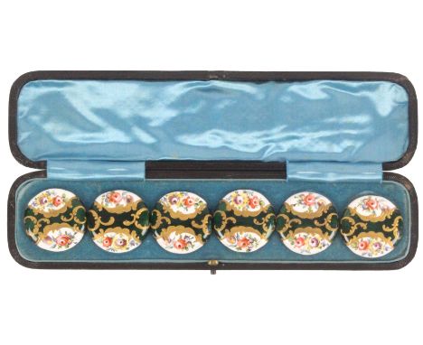 Buttons - a cased set of six large late 19th Century enamel decorated buttons each with a central green panel overlaid in gil