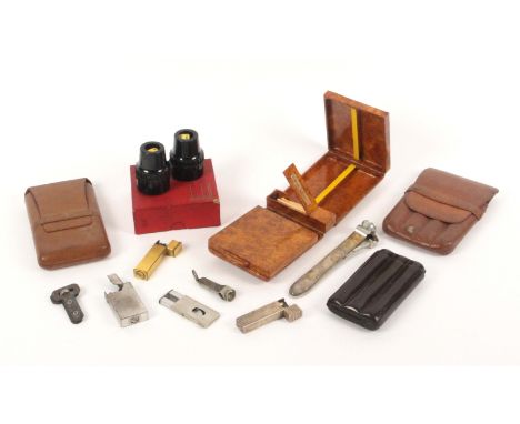 A collection of smoking paraphanalia, comprising a silver cigarette lighter with makers mark of Alred Dunhill, and hallmarked