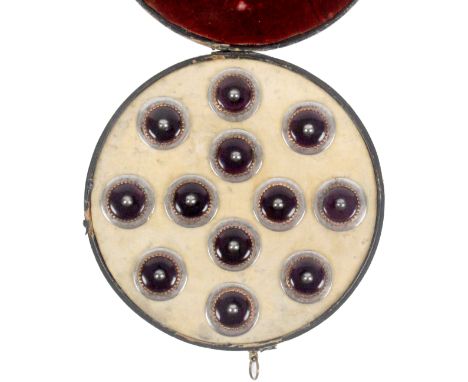 Buttons - a rare set of twelve 18th Century buttons contained in their original black leather circular box, with wall mount h