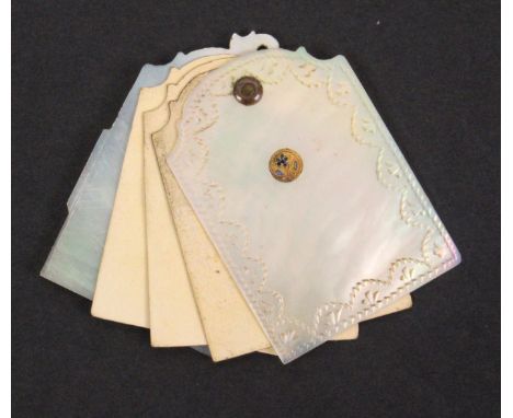 An early 19th Century Palais Royal swivel notelet, the mother of pearl covers with stepped arched top and engraved borders, t