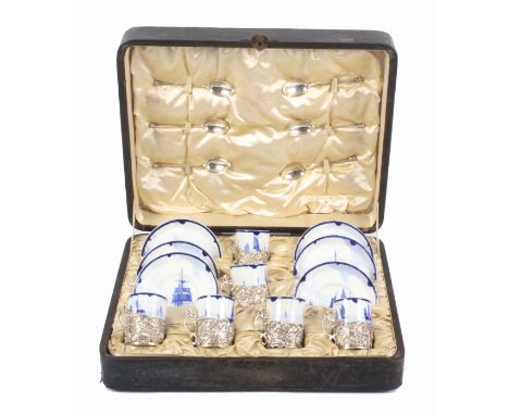 A Royal Crown Derby coffee set for six settings in fitted case, the cylinder cups decorated in the Delft style with sailing b