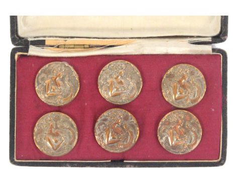 A cased set of six Art Nouveau style gilded metal circular buttons, each with waist length woman playing a harp, each stamped