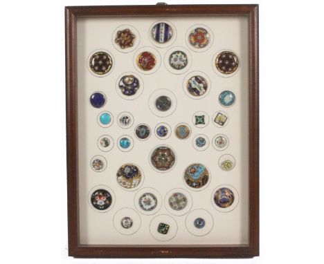 Buttons - a fine framed display of thirty five enamel decorated buttons, including three 18th Century examples, largest 3cm, 