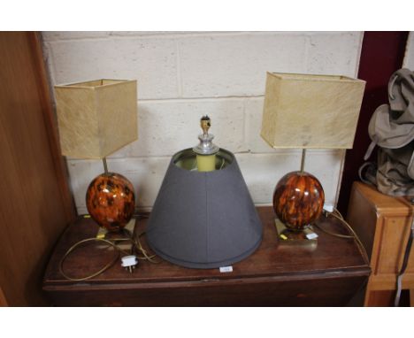 A pair of modern brown glazed table lamps and shades and a celadon glazed baluster table lamp; and two grey lamp shades