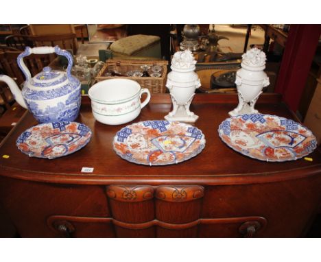 A Copeland Spode Italian patterned large teapot; three Imari platters; a pair of continental vases and a chamber pot 