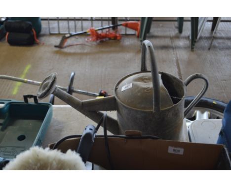 A vintage galvanised watering can