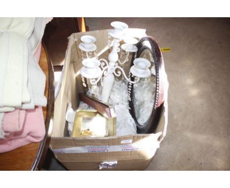 A hanging ceiling light; an oval bevel edged wall mirror etc.
