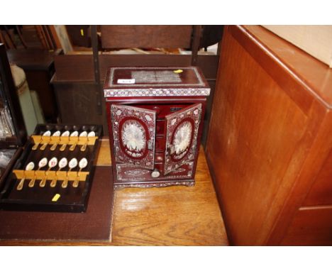 An oriental mother of pearl trinket cabinet