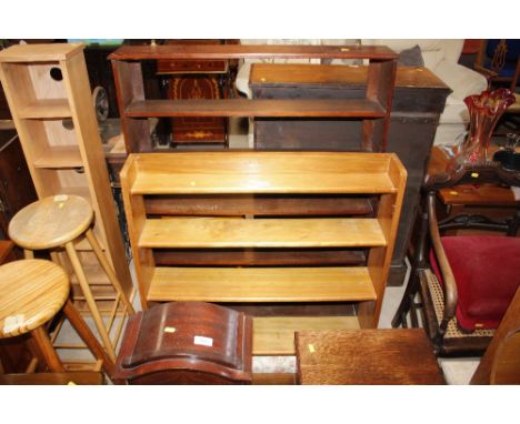 A set of mahogany open fronted bookshelves; and a light wood set