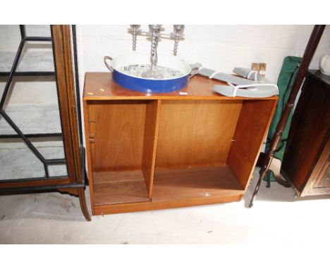 A light wood bookcase fitted with adjustable shelves