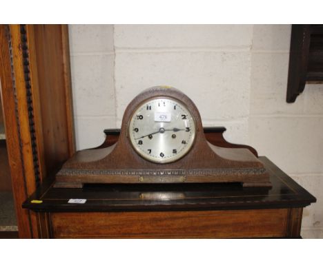 An 1930's oak striking mantel clock 
