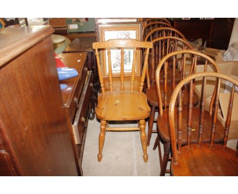 A set of four pine stick-back kitchen chairs