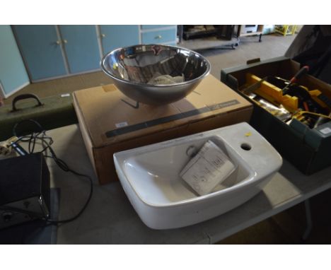 A stainless steel basin; and a porcelain basin