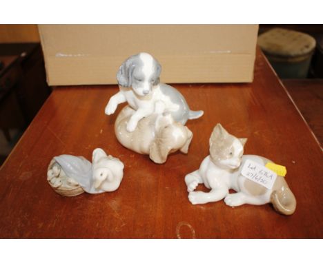 Two Lladro ornaments and an Nao ornament 