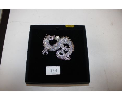 A large vintage brooch in the form of a dragon 