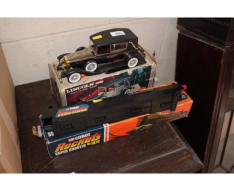 A Corgi rocket superbooster and a model of a Lincoln 1928