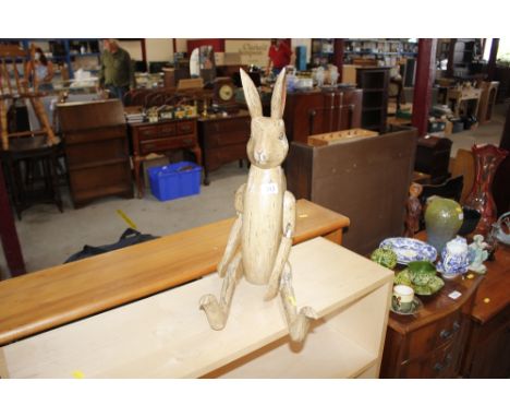 An articulated wooden model rabbit