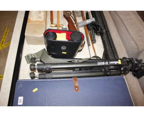 A cased pair of 10x50 binoculars; and a camera tripod 