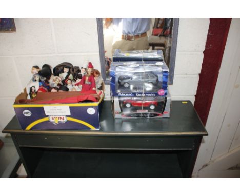 An Abrex boxed model Skoda; and a Burago boxed Mini Cooper