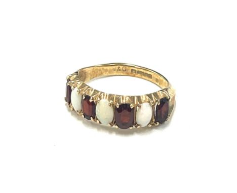 9ct gold garnet and opal ladies ring, approximate weight 2.5g 