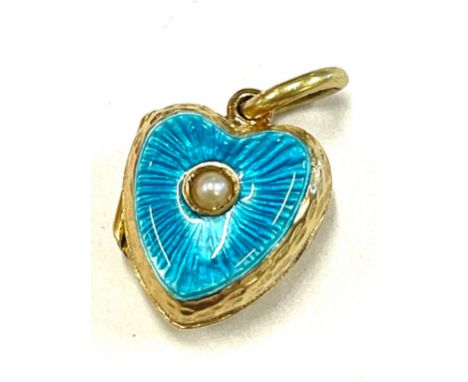 Unmarked yellow metal, enamel and seed pearl locket, tests as 15ct gold, approximate weight 5.5g 