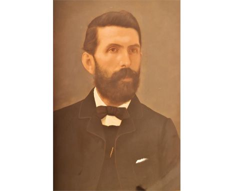 An oil on board portrait study of a nineteenth century gentleman, the bearded subject looking forward clad in formal black at