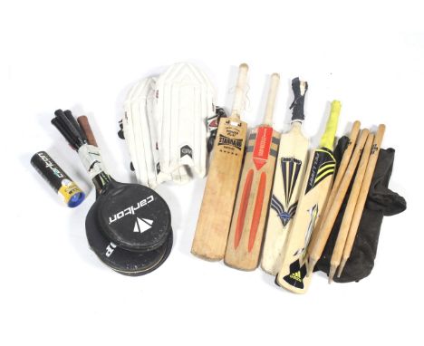 An assortment of sporting equipment. Comprising a pair of cricket leg pads, four cricket bats plus four stumps and three ball