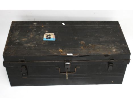 A vintage black japanned metal travelling trunk. With robin egg blue interior, swing handles front and sides, two clips and a