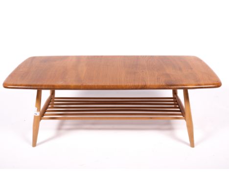 Vintage / Retro : A Blonde Elm topped Ercol coffee table with gold label. With two tiers, the undertier of gated seven-rod fo