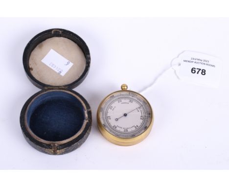 A 19th century brass pocket barometer. Diameter 5cm, in a black leather case